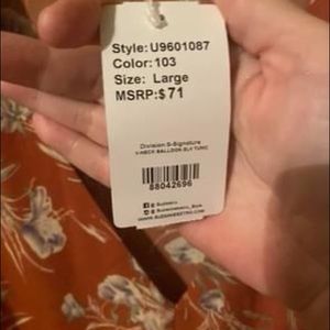 Blouse size large but runs small.